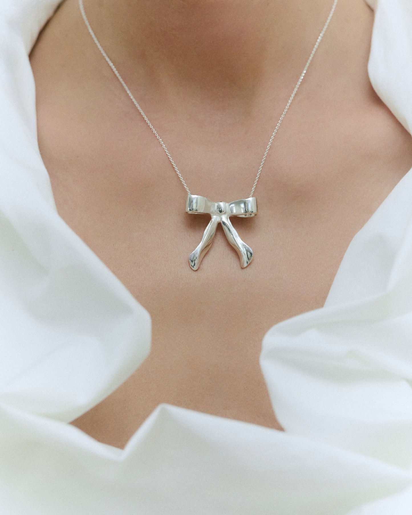 Bow Silver Medallion